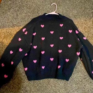 Black sweater with pink hearts